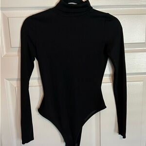 Pretty little things long sleeve Body Suit with turtle neck.
